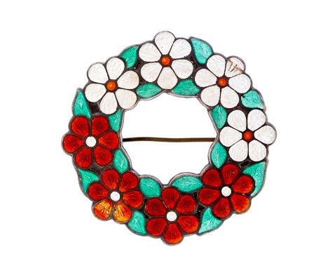 A modernist silver and enamel brooch, open circular design with floral decoration, one side with red enamel the other with wh
