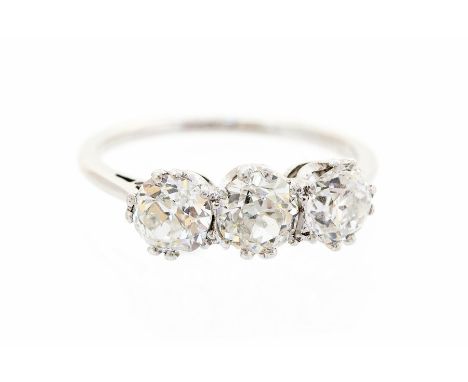 A diamond three-stone ring, comprising three claw-set old-cut diamonds, split claw coronet setting, total diamond weight appr