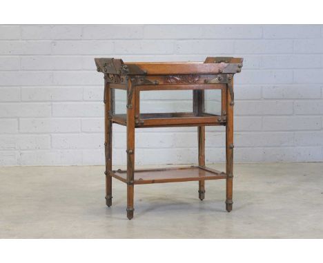 A Continental Secessionist tray-topped table, c.1900, the glass-mounted twin-handled tray of rectangular form, with brass dec