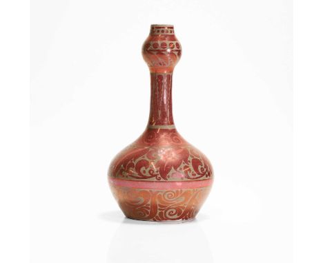 A ruby lustre solifleur stoneware vase, late 19th century, designed by William De Morgan (1839-1917), the flat bulbous body t