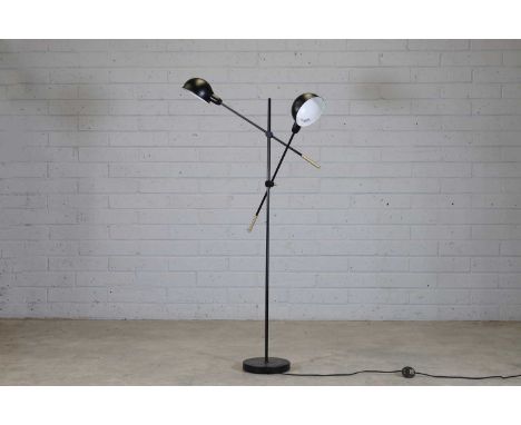 A floor lamp, modern, in the style of Serge Mouille, with two domed shades on articulating arms, the stem terminating on to a