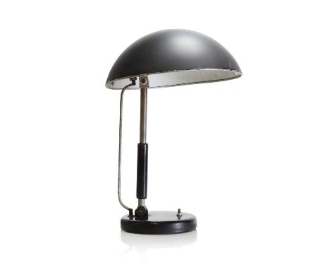 A German Bauhaus table lamp, 1930s, designed by Karl Trabert for Scacho, with a domed painted metal shade, raised on an artic