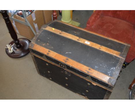 A wooden and metal bound trunk 