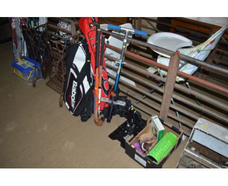 A quantity of hockey sticks, bags, pogo stick, box of exercise equipment etc. 