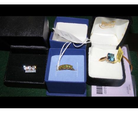 Three dress rings including a 9ct gold London blue topaz and diamond ring with certificateCONDITION REPORTSize O/P