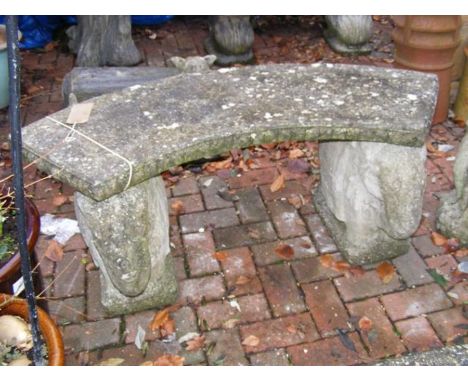 A concrete garden bench with 'elephant' support