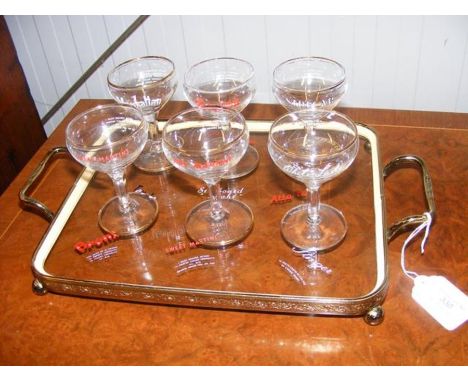 A set of six vintage mid century champagne saucers / coupe glasses bearing retro cocktail artwork and recipes, together with 