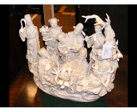 A Chinese ceramic figural group of Immortals - 30cms highCONDITION REPORTsigns of loss, damage and repair in placescrack to b