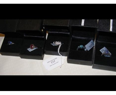 A ruby and red diamond ring in silver setting with certificate together with four others