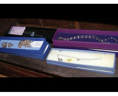 A ruby pendant necklace on silver chain together with other necklaces and bracelet