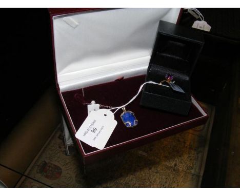 A lapis lazuli diamond sterling silver pendant on chian, together with a gold dress ring with purple stone