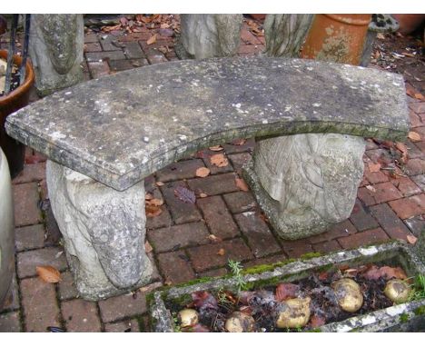 A concrete garden bench with 'elephant' support