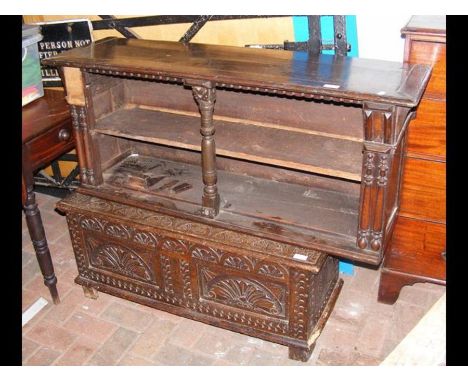 A period oak carved coffer - 96cms wide, together with an oak hanging shelf, 118cms long