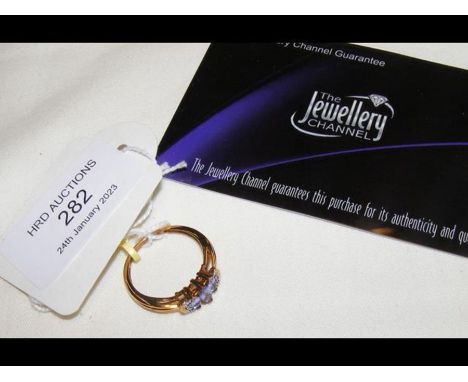 A 9ct gold tanzanite and diamond ring with certificate