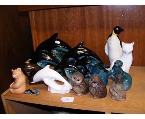A collection of Poole Pottery dolphins and other ornaments 