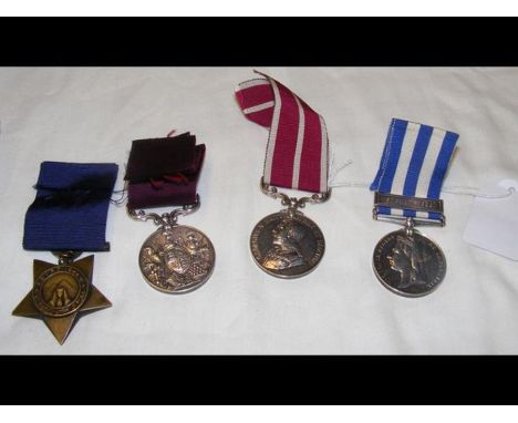 An Egypt medal with Suakin 1885 bar, Long Service and Good Conduct medal and Meritorious Service medal to QM Sgt. A Woodlock,