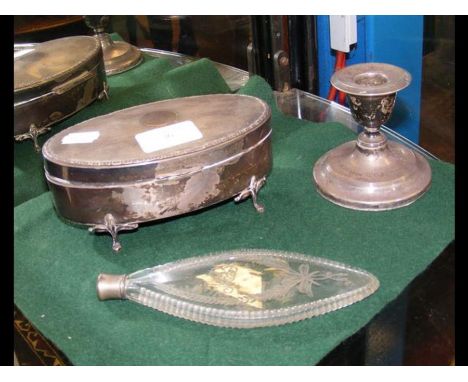 A silver oval jewellery box together with scent bottle and candlestick