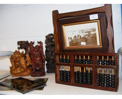 A Victorian two sided photo frame, together with abacus and assorted treen statuettes 