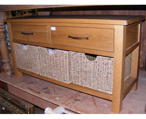 A modern oak hall bench with two drawers and three baskets below - length 107cm 