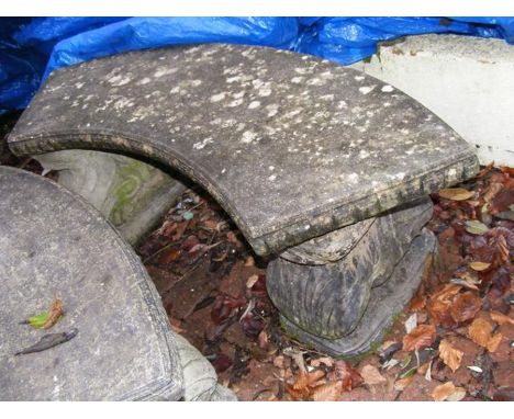 An attractive curve concrete garden bench
