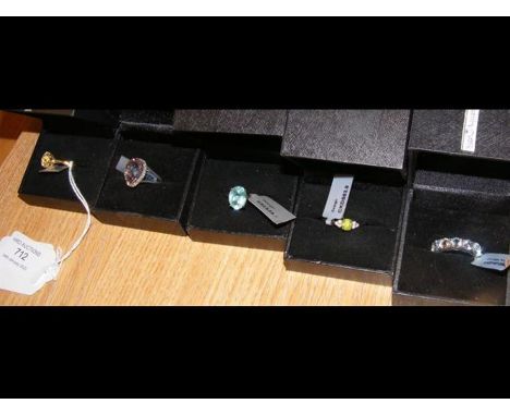 A blue topaz ring in silver setting with certificate and four others