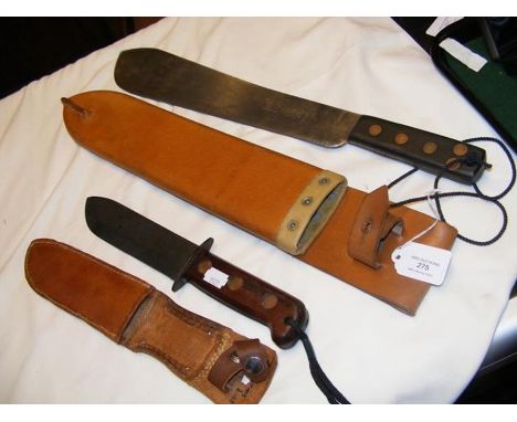 A Martindale machete in leather scabbard together with an army issue dagger in leather scabbard