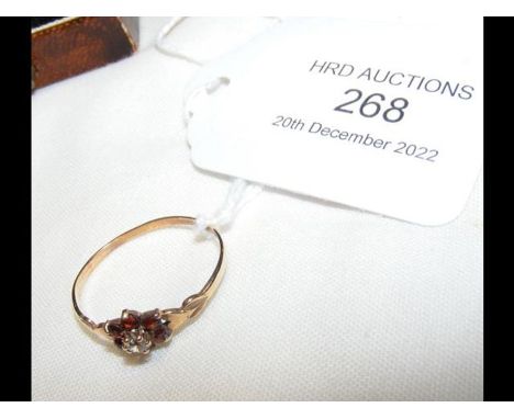 A diamond and red stone dress ring in 9ct gold setting 