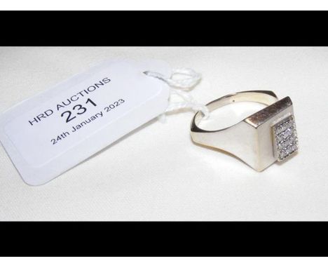 An 18ct white gold dress ring with twelve stone diamond mount
