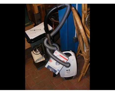 A Miele Compact C2 Allergy Vacuum Cleaner with tools and extra bags 