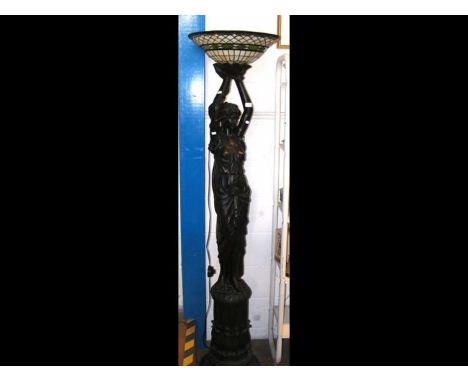 A Tiffany style figural standard lamp with up-lighter shade CONDITION REPORTin our opinion the figure is made of resinno sign