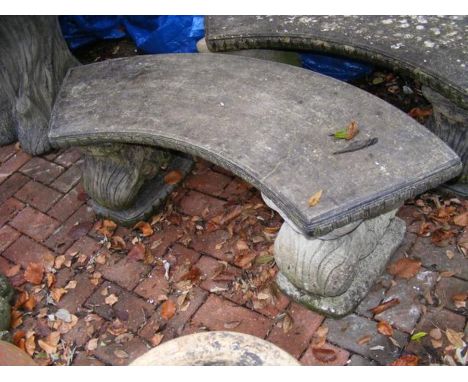 An attractive curve concrete garden bench