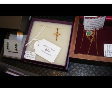 A 9ct gold ruby and diamond cross pendant on gold chain together with one other pendant and earrings