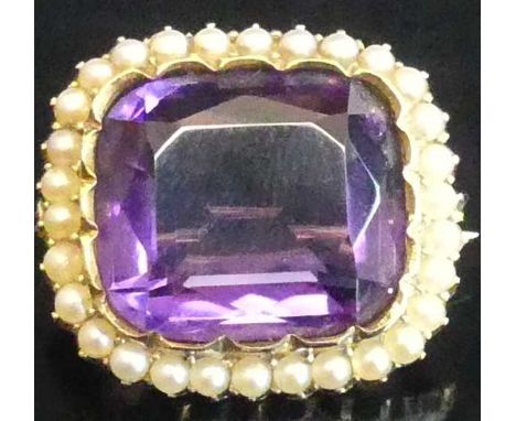 An Edwardian yellow metal amethyst and seed pearl set brooch, 21 x 18.5mm