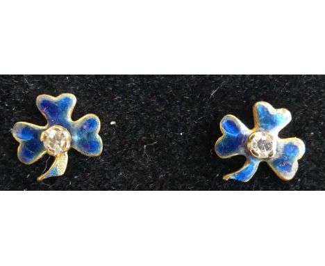 A pair of yellow metal diamond point and enamel set ear studs, each fashioned as a three-leaf clover, the backs stamped 750, 