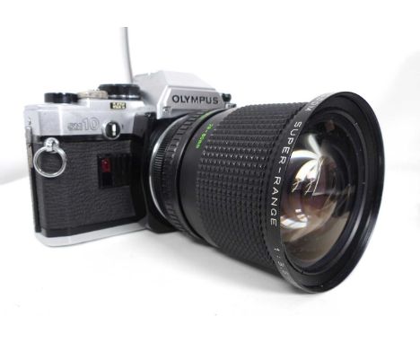 A vintage Olympus OM10 SLR camera, cased with accessories