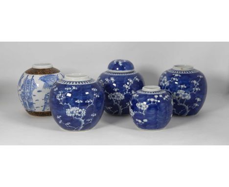 A Chinese porcelain ginger jar and cover, underglaze decorated in the blue and white prunus pattern, h.15cm; together with fo