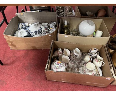 Three boxes of glassware, ceramics and metal wares to include a brass oil lamp, and a Royal Doulton English Rose pattern part