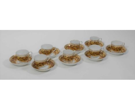 A collection of 19th century gilt and enamel decorated tea cups, coffee cans and saucers