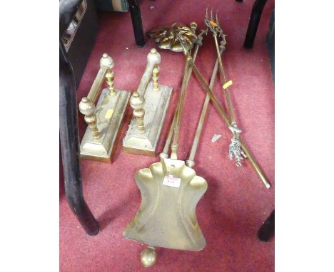 A collection of brass fire tools, together with a pair of brass fire dogs 