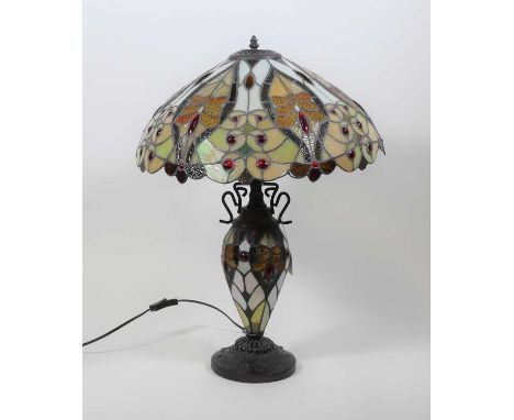 A Tiffany style table lamp, having a stained glass shade and stem, h.62cm 