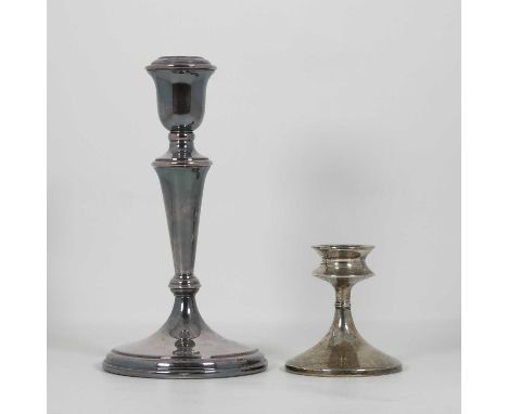 An Elizabeth II silver table candlestick, loaded, height 22cm, together with another smaller (2)