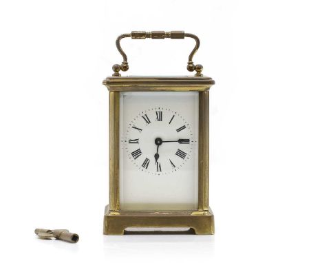 A lacquered brass cased carriage clock, the enamelled dial showing Roman numerals, h.14.5cm 