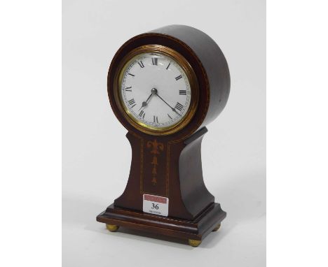 An Edwardian mahogany and boxwood strung balloon mantel clock, the enamelled dial showing Roman numerals, h.24cm