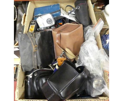 A collection of photography equipment, to include an Olympus OM10 SLR cameraOne other camera in the lot, being a Praktika Sup