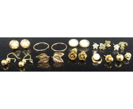 A collection of principally 9ct gold modern ear studs, to include a pair of opal set examples, pair of flower head examples, 