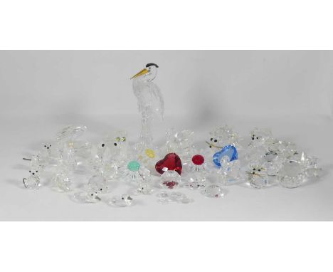 A Swarovski crystal figure of a heron, h.14.5cm; together with various others to include a hedgehog, oyster with pearl, flowe