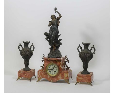A 19th century French spelter and rouge marble mantel clock garniture, the enamelled dial showing Arabic numerals, having eig