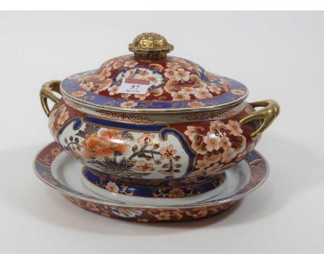 A porcelain tureen and stand, heavily enamel decorated with flowers, w.29cm 