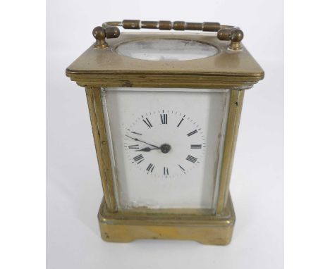 A lacquered brass carriage clock, the enamelled dial showing Roman numerals, having visible platform escapement, h.13cm 