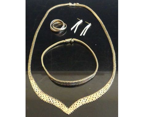 A modern 9ct three-colour gold suite, comprising wishbone necklace, bracelet, ring, and ear studs, gross weight 24.3g (4)Neck